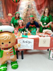 Group of nurses dressed as Elves for a Christmas party in hospital