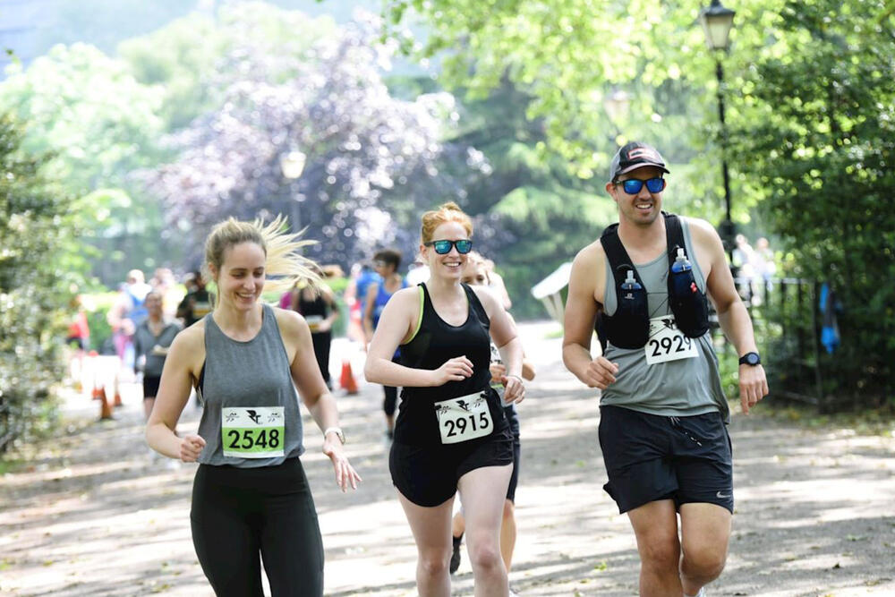 A man and two women running