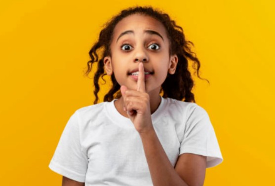 Child with finger on their mouth