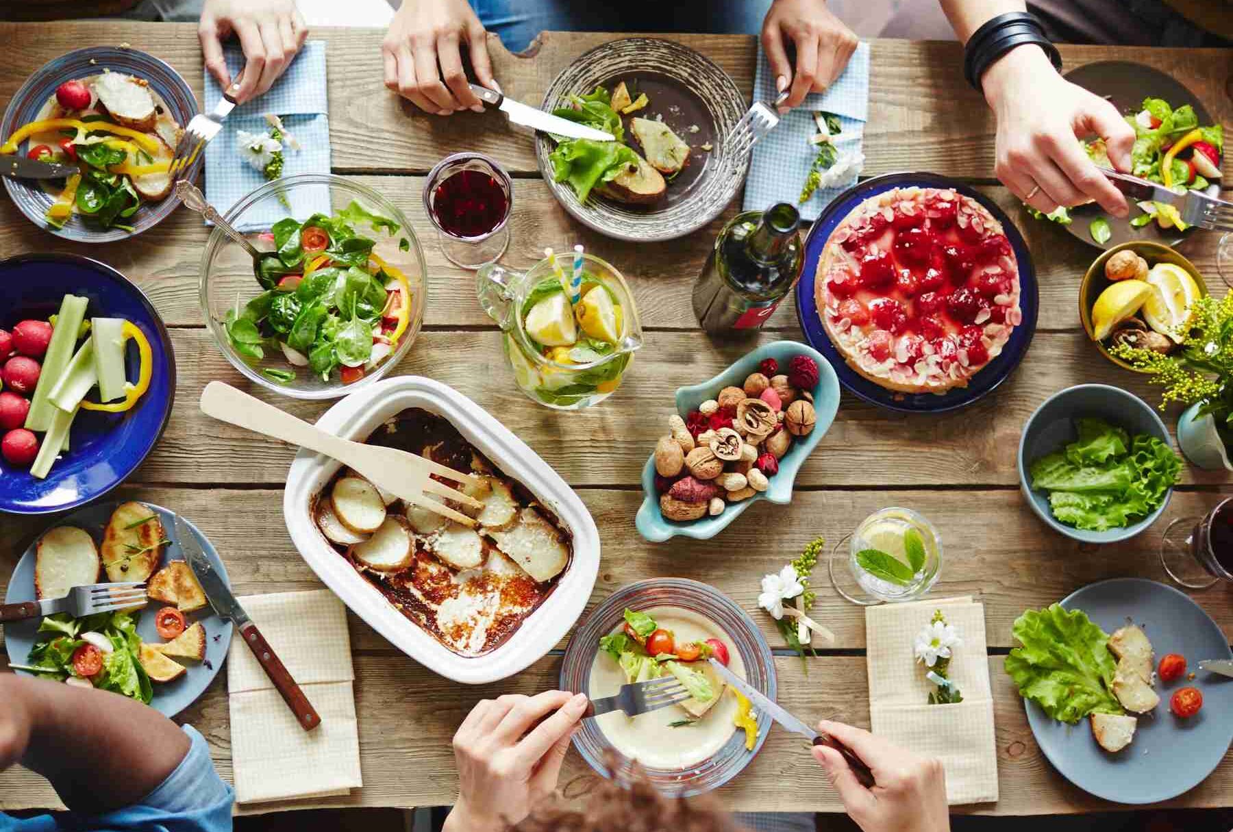 Table filled with food and drinks.
